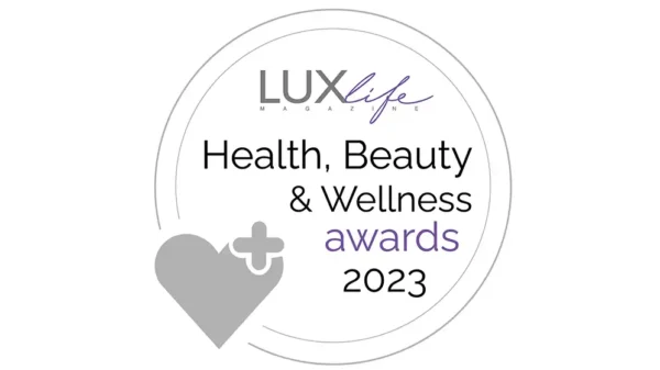 LUXlife Health Beauty and Wellness Awards 2023 circular silver badge with heart icon and minimalist typography