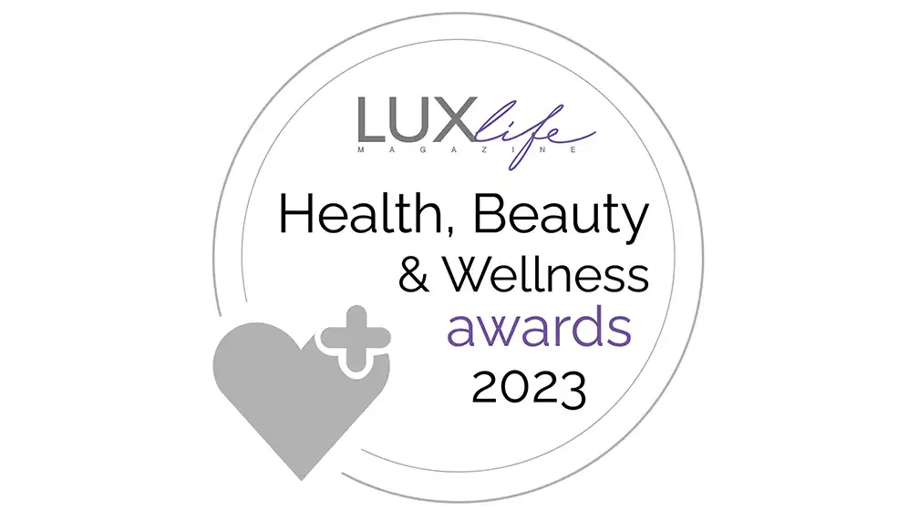LUXlife Health Beauty and Wellness Awards 2023 circular silver badge with heart icon and minimalist typography