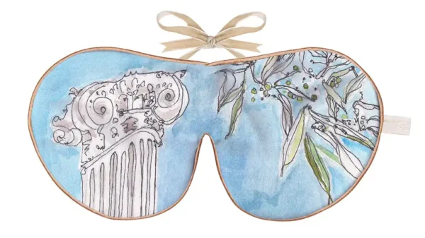 Silk sleep mask with a blue watercolour background featuring an illustrated classical column and leafy branches.