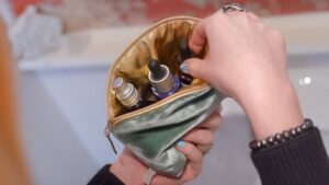 An elegant Lavender make up bag, perfectly sized for carrying your everyday makeup essentials it features an illuminating gold waterproof lining and hidden Lavender flower filling.