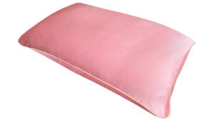 A flat image of the Holistic Silk Pillowcase in Rose colour Mulberry Silk laid diagonally across the shot showing the honey coloured piping.