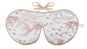 Flat image of the Holistic Silk Limited Edition Brocade Sleep Mask in a Silver Fish design featuring pink colour koi carp on a silver beackround with Honey colour piping and a Honey colour velvet bow above it on a clear white background.