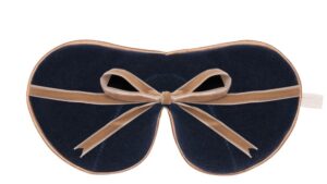 Flat image of the reverse of the Holistic Silk Limited Edition & Silk Velvet Sleep Masks showing the Navy reverse, Honey colour piping and the Honey colour velvet bow tied and sitting across the middle of the mask.