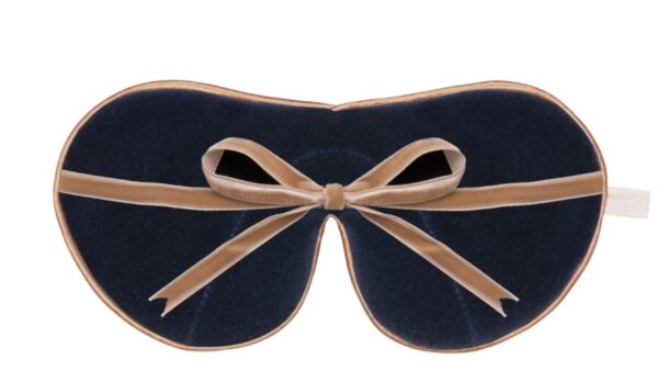 Flat image of the reverse of the Holistic Silk Limited Edition & Silk Velvet Sleep Masks showing the Navy reverse, Honey colour piping and the Honey colour velvet bow tied and sitting across the middle of the mask.