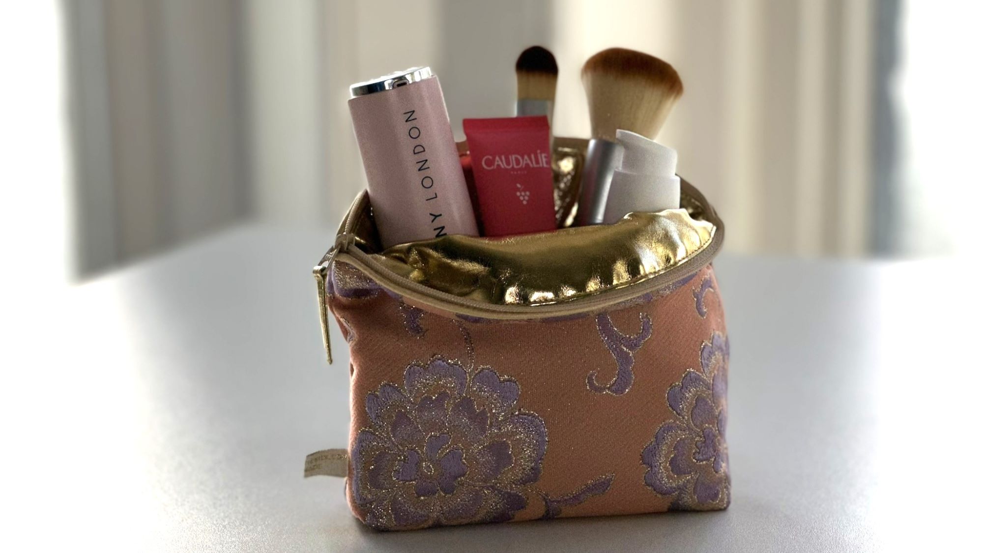make up bag and lining Peach with room enough for all these products.