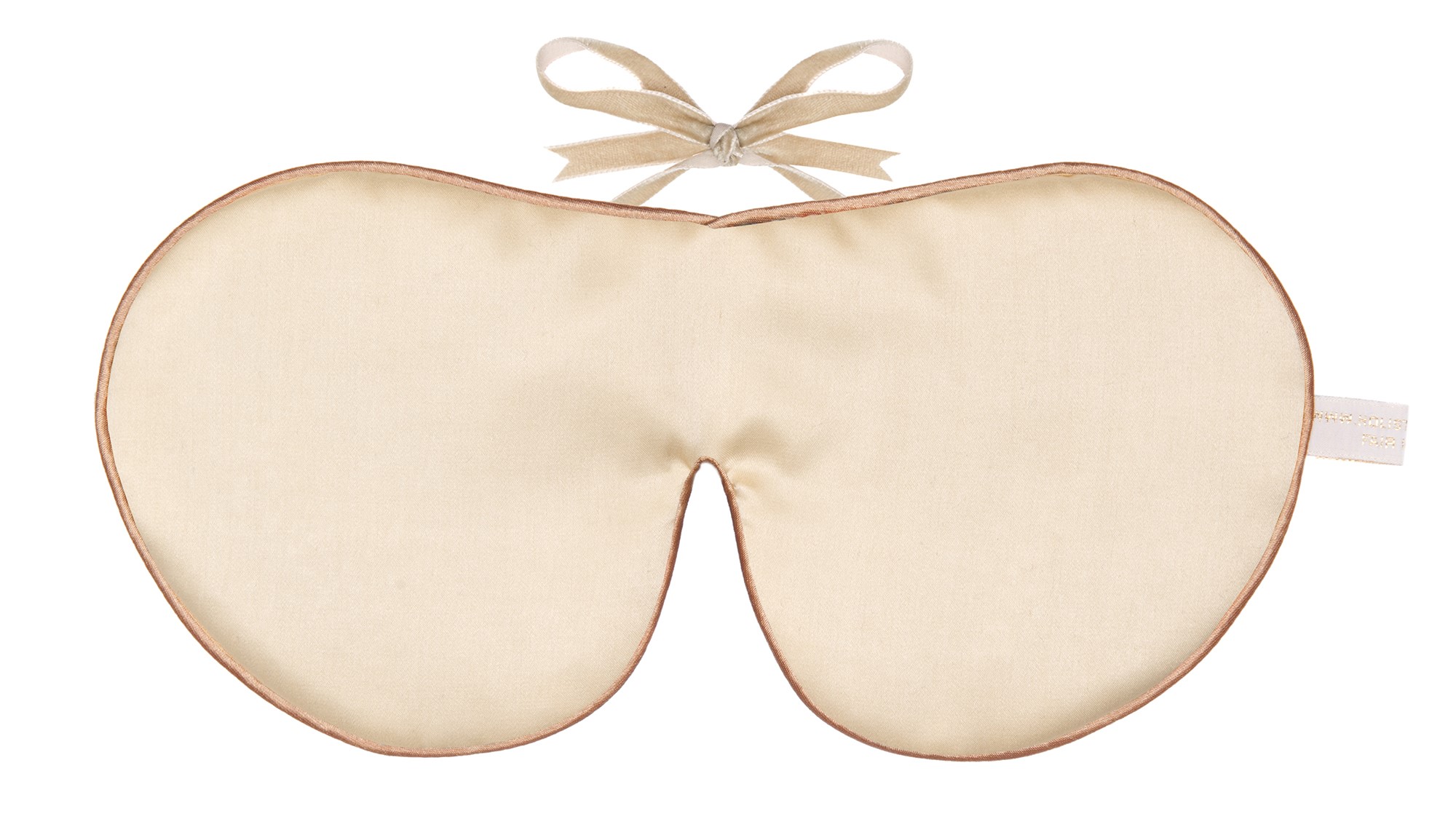Flat image of the Holistic Silk Classic Silk Sleep Mask in a Cream colour with Honey colour piping and a Honey colour velvet bow above it on a clear white background.