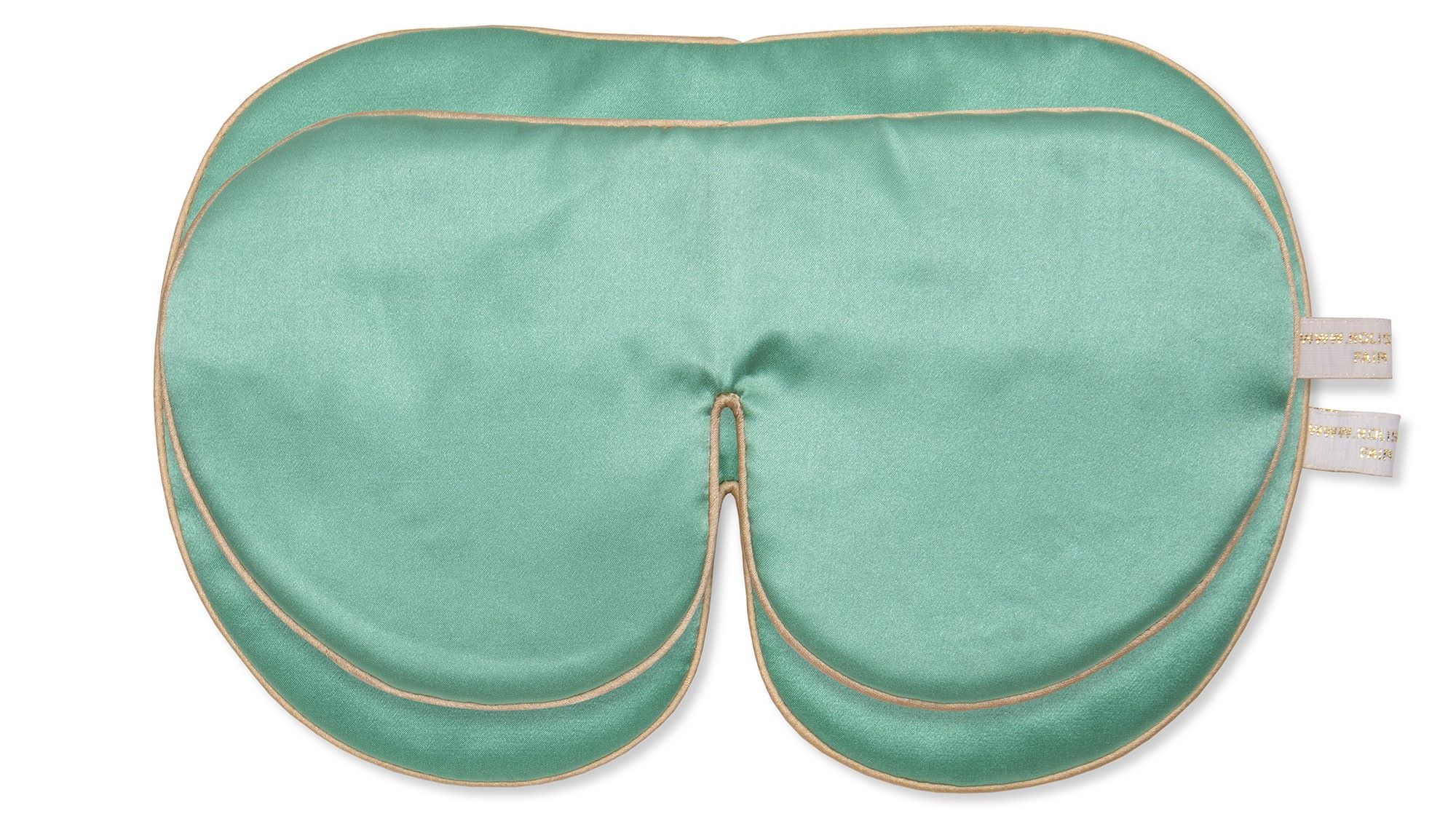 Flat image of the Holistic Silk Deluxe Sleep Mask in Jade with a smaller Cl;assic Silk Sleep Mask on top to illustarte the size difference on a clear white background.