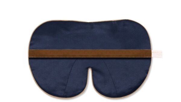 Flat image of the reverse the Holistic Silk Deluxe Silk Sleep Mask showing the Navy colour reverse with the soft honey coloured, flat velvet elasticated strap across the middle.