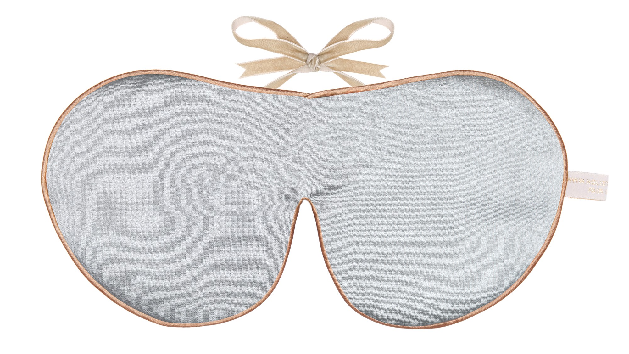 Flat image of the Holistic Silk Classic Silk Sleep Mask in a Silver colour with Honey colour piping and a Honey colour velvet bow above it on a clear white background.