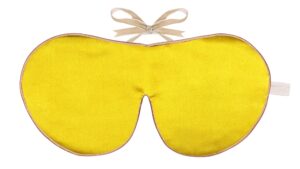 Flat image of the Holistic Silk Classic Silk Sleep Mask in a Sundrop Yellow colour with Honey colour piping and a Honey colour velvet bow above it on a clear white background.