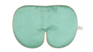 Flat image of the Holistic Silk Deluxe Silk Sleep Mask in a Jade colour with Honey colour piping on a clear white background.