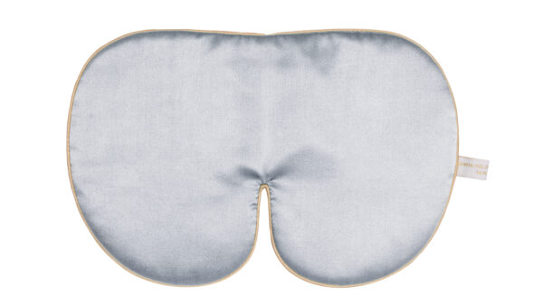 Flat image of the Holistic Silk Deluxe Silk Sleep Mask in a Silver colour with Honey colour piping on a clear white background.