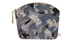 Navy blue make up bag with intricate Japanese wave pattern and honey coloured piping and tassel zip