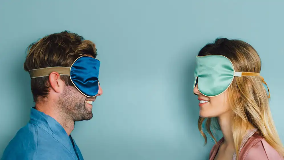 Jade and Navy Classic Silk Eye Mask being worn