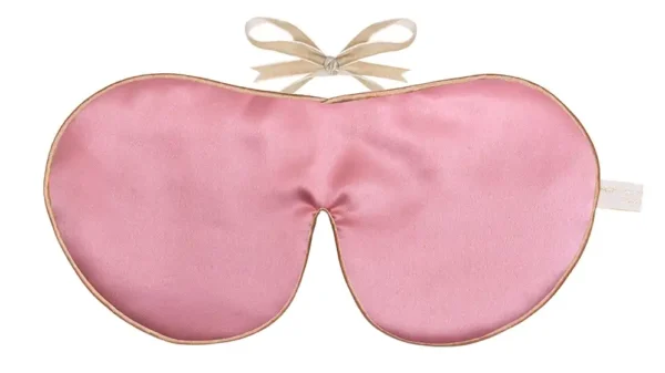 Rose colour silk sleep mask with honey‑coloured piping and silk ribbon tie, shown flat on a white background.